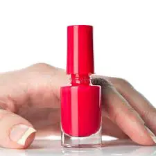 red nail polish finger