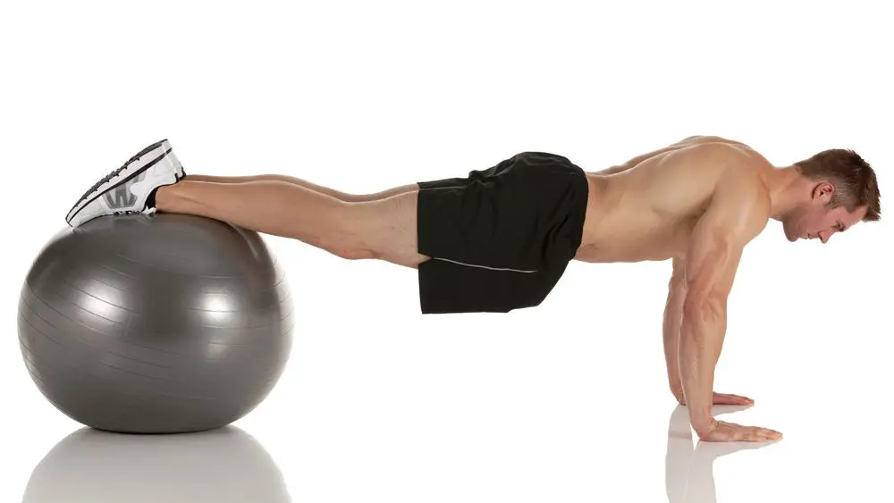 legs should be on top of the stability ball
