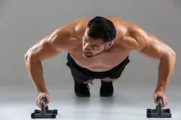 Doing push up powerlifting exercise